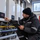 Commercial heating engineer diagnosing a boiler lockout on a cascade system in a cold-weather plant room